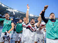 Riccardo Orsolini of Bologna FC and his team-mates celebrate the victory at the end of the Serie A Enilive match between AS Roma and Bologna...