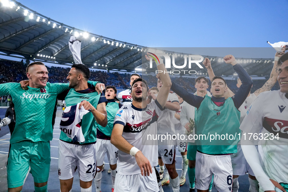 Riccardo Orsolini of Bologna FC and his team-mates celebrate the victory at the end of the Serie A Enilive match between AS Roma and Bologna...