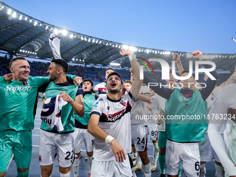 Riccardo Orsolini of Bologna FC and his team-mates celebrate the victory at the end of the Serie A Enilive match between AS Roma and Bologna...