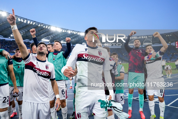 Riccardo Orsolini of Bologna FC and his team-mates celebrate the victory at the end of the Serie A Enilive match between AS Roma and Bologna...