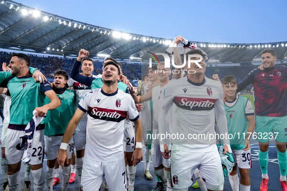 Riccardo Orsolini of Bologna FC and his team-mates celebrate the victory at the end of the Serie A Enilive match between AS Roma and Bologna...