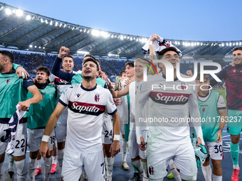 Riccardo Orsolini of Bologna FC and his team-mates celebrate the victory at the end of the Serie A Enilive match between AS Roma and Bologna...