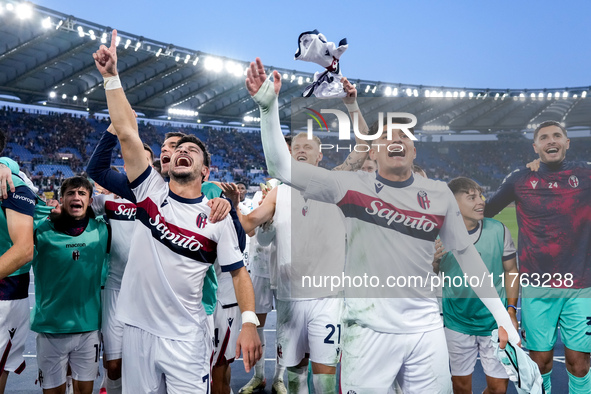 Riccardo Orsolini of Bologna FC and his team-mates celebrate the victory at the end of the Serie A Enilive match between AS Roma and Bologna...