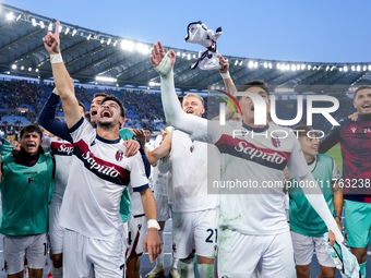 Riccardo Orsolini of Bologna FC and his team-mates celebrate the victory at the end of the Serie A Enilive match between AS Roma and Bologna...