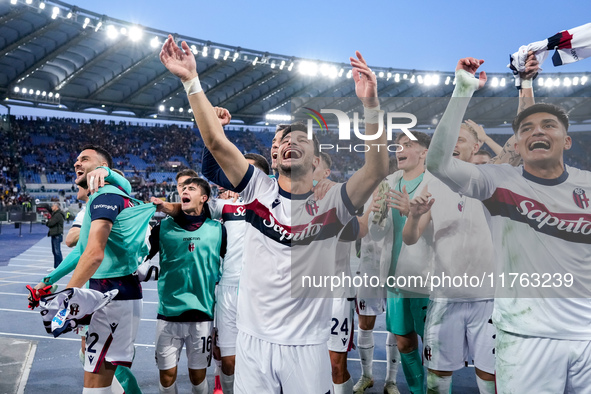 Riccardo Orsolini of Bologna FC and his team-mates celebrate the victory at the end of the Serie A Enilive match between AS Roma and Bologna...