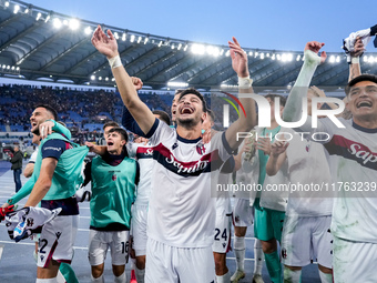 Riccardo Orsolini of Bologna FC and his team-mates celebrate the victory at the end of the Serie A Enilive match between AS Roma and Bologna...