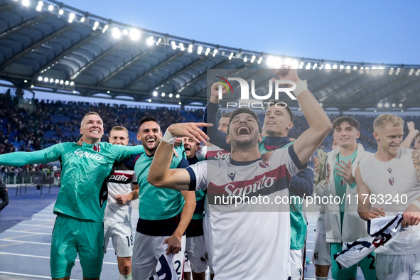 Riccardo Orsolini of Bologna FC and his team-mates celebrate the victory at the end of the Serie A Enilive match between AS Roma and Bologna...