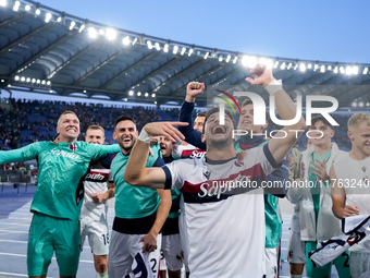 Riccardo Orsolini of Bologna FC and his team-mates celebrate the victory at the end of the Serie A Enilive match between AS Roma and Bologna...