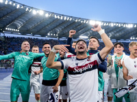 Riccardo Orsolini of Bologna FC and his team-mates celebrate the victory at the end of the Serie A Enilive match between AS Roma and Bologna...