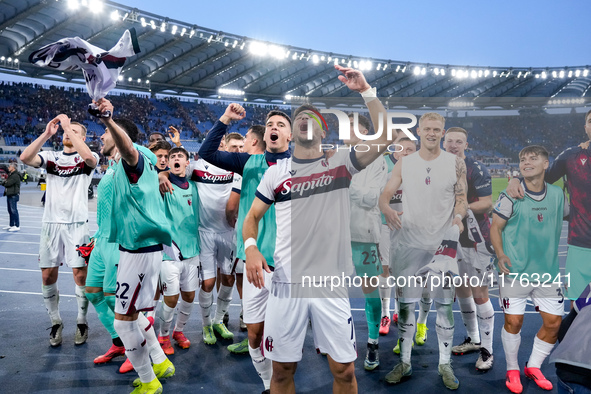 Riccardo Orsolini of Bologna FC and his team-mates celebrate the victory at the end of the Serie A Enilive match between AS Roma and Bologna...