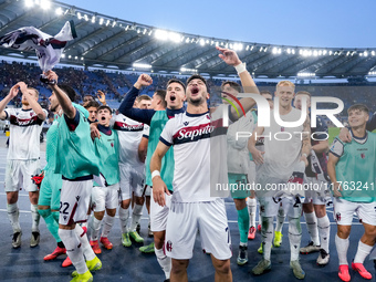 Riccardo Orsolini of Bologna FC and his team-mates celebrate the victory at the end of the Serie A Enilive match between AS Roma and Bologna...