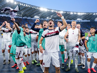 Riccardo Orsolini of Bologna FC and his team-mates celebrate the victory at the end of the Serie A Enilive match between AS Roma and Bologna...