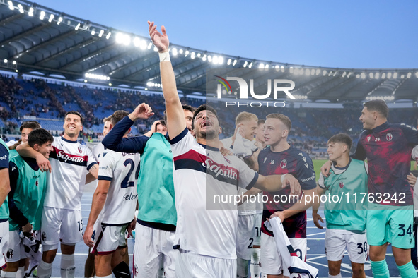 Riccardo Orsolini of Bologna FC and his team-mates celebrate the victory at the end of the Serie A Enilive match between AS Roma and Bologna...