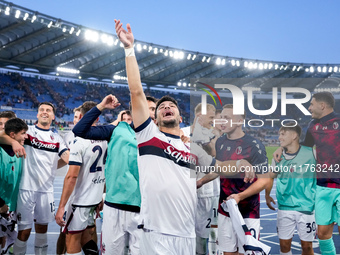 Riccardo Orsolini of Bologna FC and his team-mates celebrate the victory at the end of the Serie A Enilive match between AS Roma and Bologna...