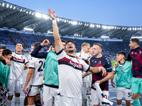 Riccardo Orsolini of Bologna FC and his team-mates celebrate the victory at the end of the Serie A Enilive match between AS Roma and Bologna...