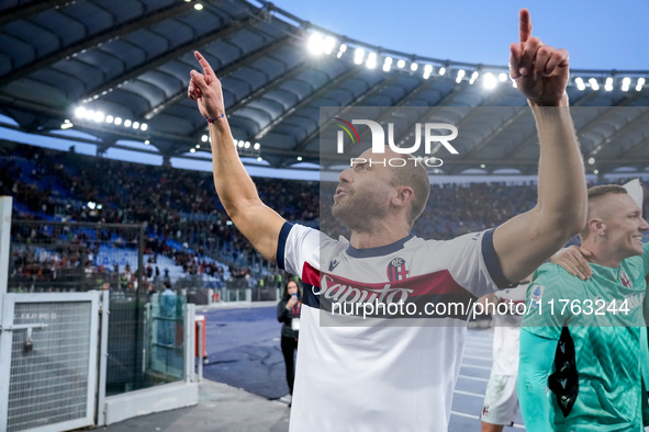 Lorenzo De Silvestri of Bologna FC celebrates the victory at the end of the Serie A Enilive match between AS Roma and Bologna FC at Stadio O...