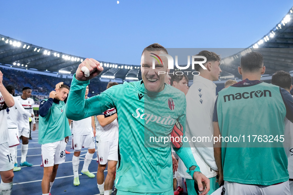 Lukasz Skorupski of Bologna FC celebrates the victory at the end of the Serie A Enilive match between AS Roma and Bologna FC at Stadio Olimp...