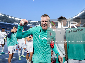 Lukasz Skorupski of Bologna FC celebrates the victory at the end of the Serie A Enilive match between AS Roma and Bologna FC at Stadio Olimp...