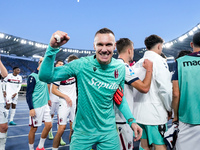 Lukasz Skorupski of Bologna FC celebrates the victory at the end of the Serie A Enilive match between AS Roma and Bologna FC at Stadio Olimp...