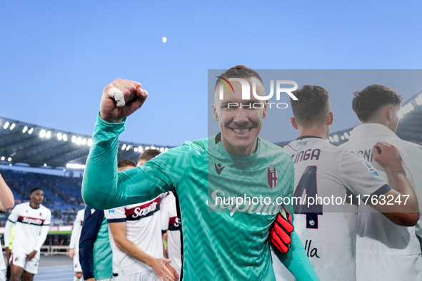 Lukasz Skorupski of Bologna FC celebrates the victory at the end of the Serie A Enilive match between AS Roma and Bologna FC at Stadio Olimp...