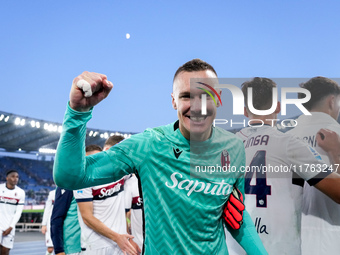 Lukasz Skorupski of Bologna FC celebrates the victory at the end of the Serie A Enilive match between AS Roma and Bologna FC at Stadio Olimp...