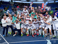 Players of Bologna FC celebrate the victory at the end of the Serie A Enilive match between AS Roma and Bologna FC at Stadio Olimpico on Nov...