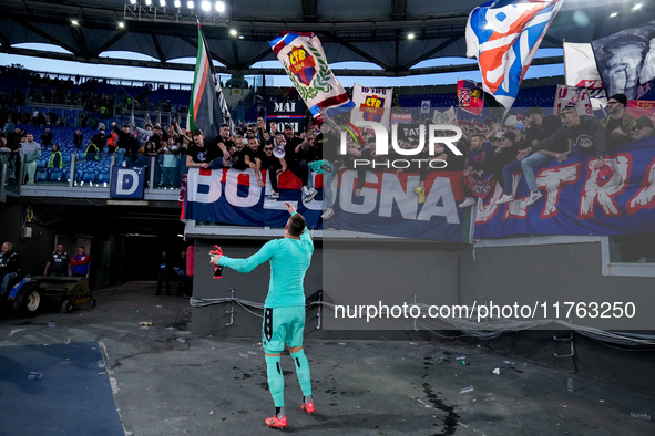 Lukasz Skorupski of Bologna FC celebrates the victory at the end of the Serie A Enilive match between AS Roma and Bologna FC at Stadio Olimp...