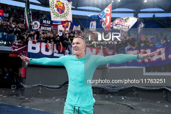 Lukasz Skorupski of Bologna FC celebrates the victory at the end of the Serie A Enilive match between AS Roma and Bologna FC at Stadio Olimp...