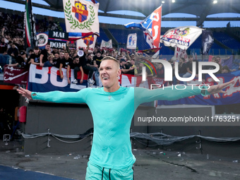 Lukasz Skorupski of Bologna FC celebrates the victory at the end of the Serie A Enilive match between AS Roma and Bologna FC at Stadio Olimp...