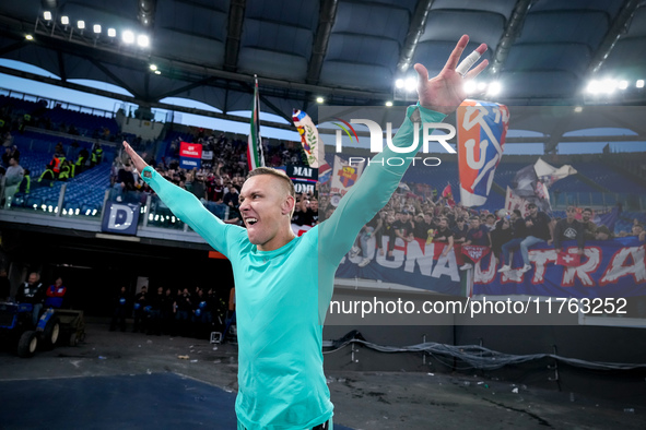 Lukasz Skorupski of Bologna FC celebrates the victory at the end of the Serie A Enilive match between AS Roma and Bologna FC at Stadio Olimp...