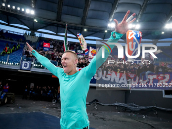 Lukasz Skorupski of Bologna FC celebrates the victory at the end of the Serie A Enilive match between AS Roma and Bologna FC at Stadio Olimp...