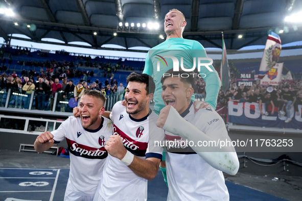 Jesper Karlsson of Bologna FC celebrates the victory with Riccardo Orsolini and Santiago Castro at the end of  the Serie A Enilive match bet...