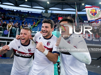 Jesper Karlsson of Bologna FC celebrates the victory with Riccardo Orsolini and Santiago Castro at the end of  the Serie A Enilive match bet...