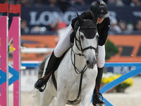 Lara Tryba rides Memphis Z during the CSI5*-W Longines FEI Jumping World Cup 2024 Grand Prix presented by KASK, at Pala Fimauto in Verona, I...