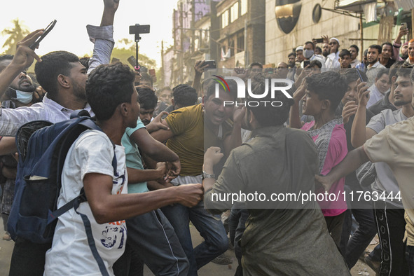 Students from anti-discrimination movements and Bangladesh Nationalist Party activists attack an Awami League supporter in Dhaka, Bangladesh...