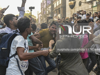 Students from anti-discrimination movements and Bangladesh Nationalist Party activists attack an Awami League supporter in Dhaka, Bangladesh...