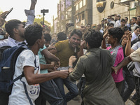 Students from anti-discrimination movements and Bangladesh Nationalist Party activists attack an Awami League supporter in Dhaka, Bangladesh...