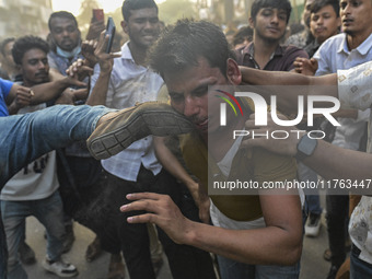 Students from anti-discrimination movements and Bangladesh Nationalist Party activists attack an Awami League supporter in Dhaka, Bangladesh...