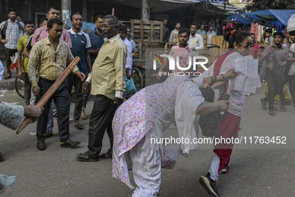 Bangladesh Nationalist Party women activists attack an Awami League woman supporter in Dhaka, Bangladesh, on November 10, 2024. 