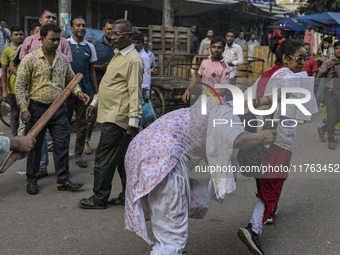 Bangladesh Nationalist Party women activists attack an Awami League woman supporter in Dhaka, Bangladesh, on November 10, 2024. (