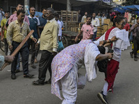 Bangladesh Nationalist Party women activists attack an Awami League woman supporter in Dhaka, Bangladesh, on November 10, 2024. (