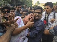 Students from anti-discrimination movements and Bangladesh Nationalist Party activists attack an Awami League woman supporter in Dhaka, Bang...