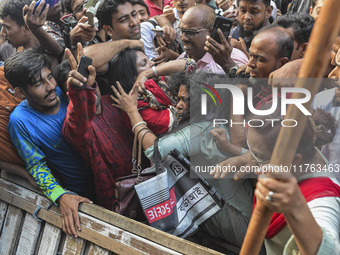 Students from anti-discrimination movements and Bangladesh Nationalist Party activists attack an Awami League woman supporter in Dhaka, Bang...