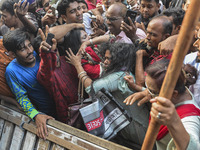 Students from anti-discrimination movements and Bangladesh Nationalist Party activists attack an Awami League woman supporter in Dhaka, Bang...