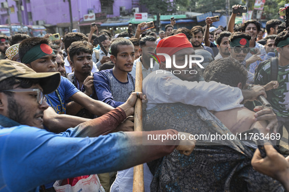 Students from anti-discrimination movements and Bangladesh Nationalist Party activists attack an Awami League supporter in Dhaka, Bangladesh...