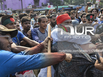 Students from anti-discrimination movements and Bangladesh Nationalist Party activists attack an Awami League supporter in Dhaka, Bangladesh...