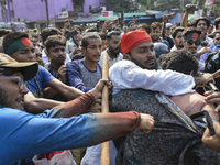 Students from anti-discrimination movements and Bangladesh Nationalist Party activists attack an Awami League supporter in Dhaka, Bangladesh...