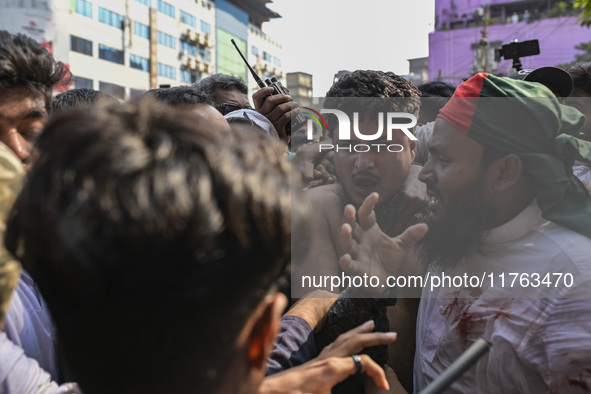 Students from anti-discrimination movements and Bangladesh Nationalist Party activists attack an Awami League supporter in Dhaka, Bangladesh...