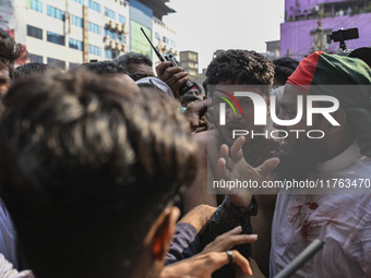 Students from anti-discrimination movements and Bangladesh Nationalist Party activists attack an Awami League supporter in Dhaka, Bangladesh...