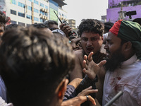 Students from anti-discrimination movements and Bangladesh Nationalist Party activists attack an Awami League supporter in Dhaka, Bangladesh...